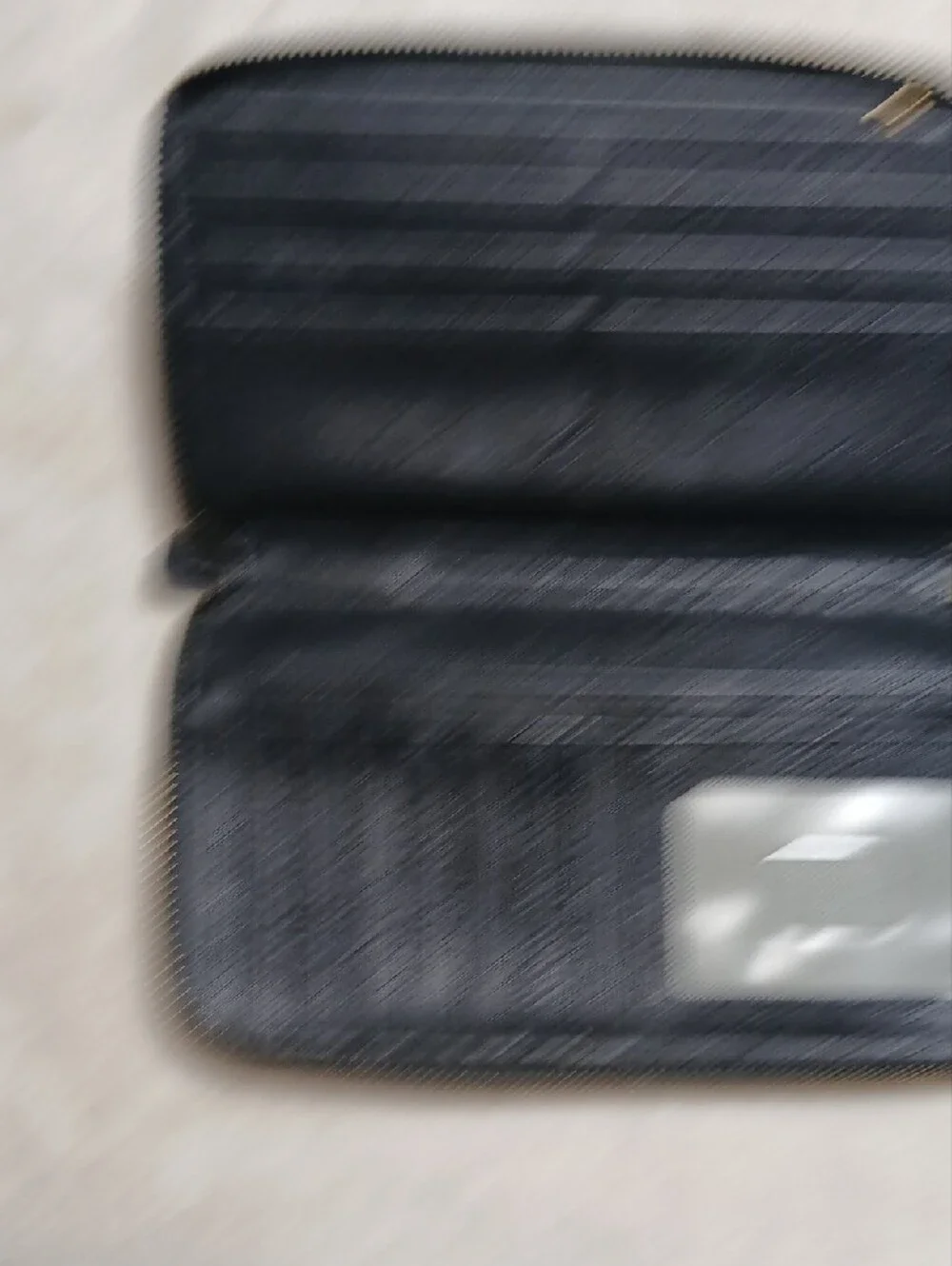 Fossil Black Leather Zip-Around Wallet with Gold Accent